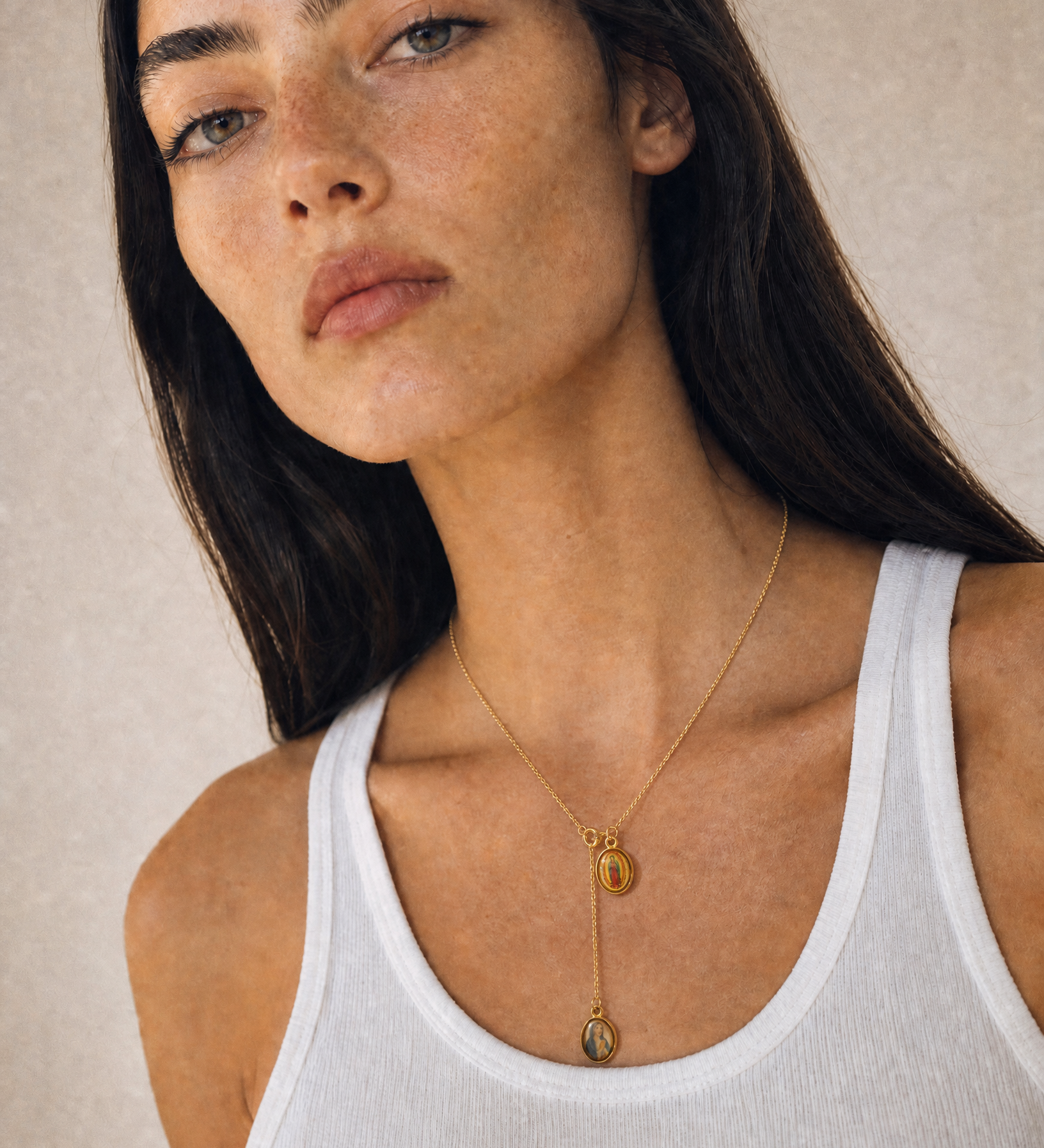 GeneratedwithKive.ai-UseImage1asthecleanportraitcanvas.Removeeverypartofthenecklacethatwasoriginallyworn_includinganyleftoverchain_beads_pendants_clasps_andshadows.Thenplaceonlytheexa.png