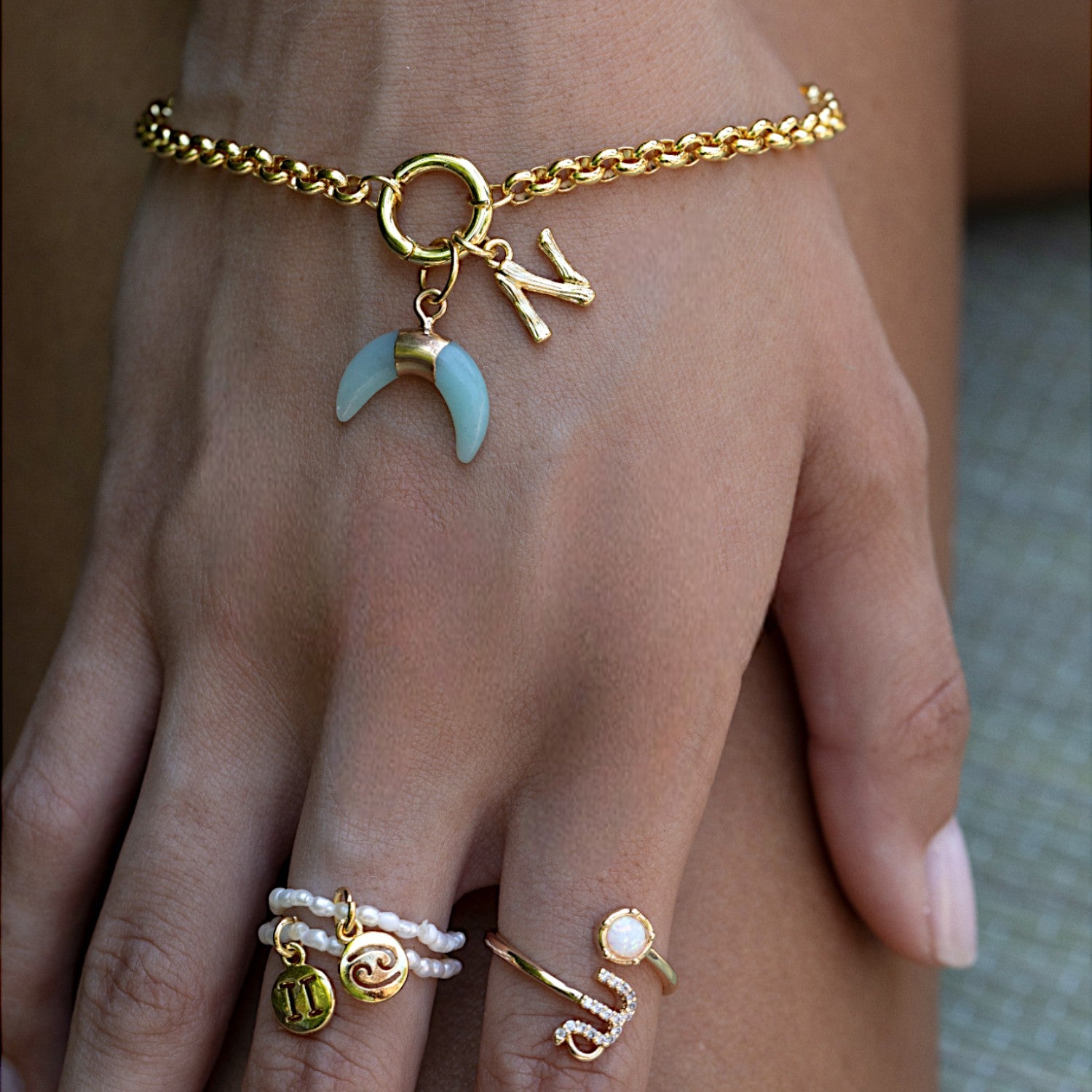 ROLOCHARMBRACELETANDPEARLRINGS-Photoroom.jpg